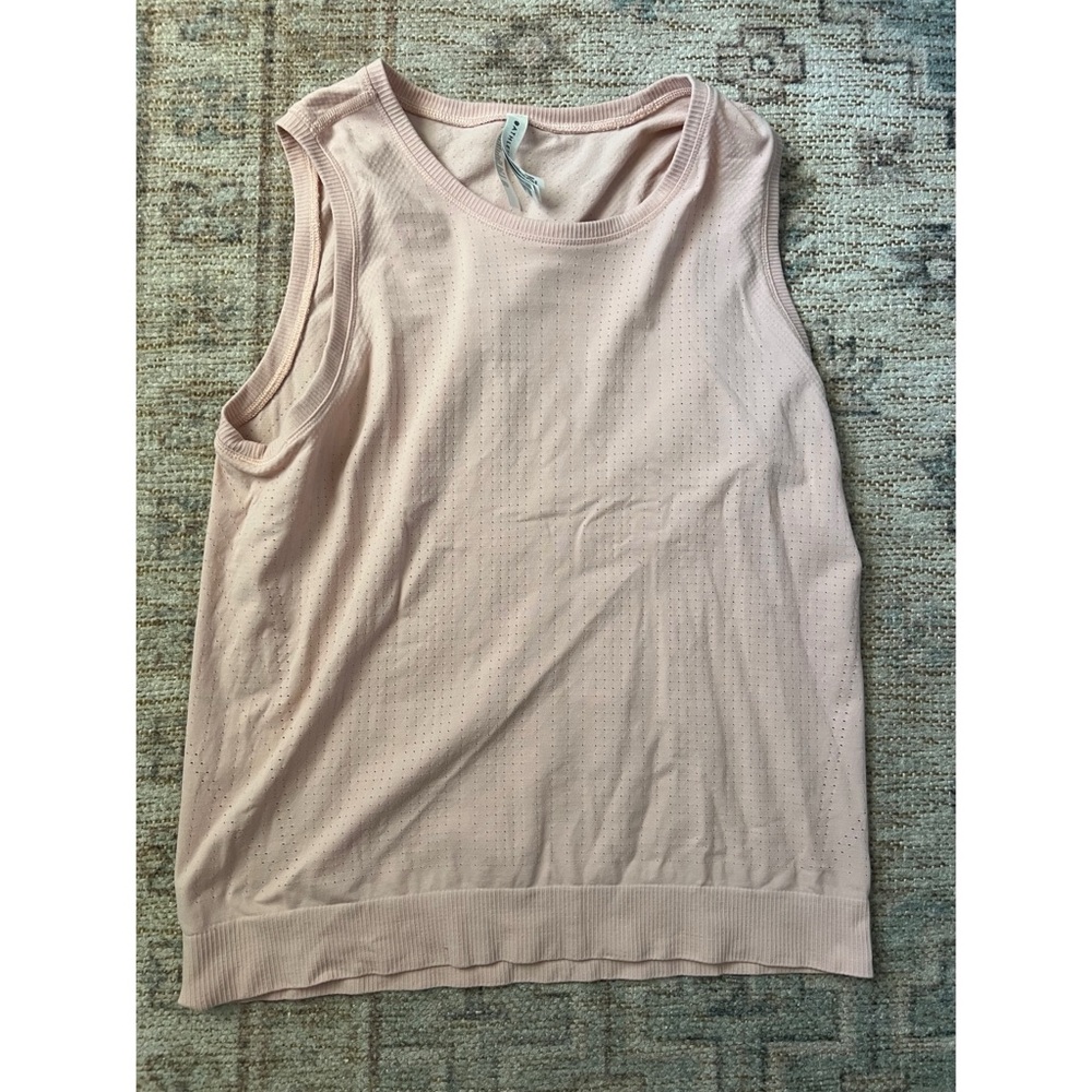Sleeveless Pink workout top, brand is Athleta, super cute and comfy